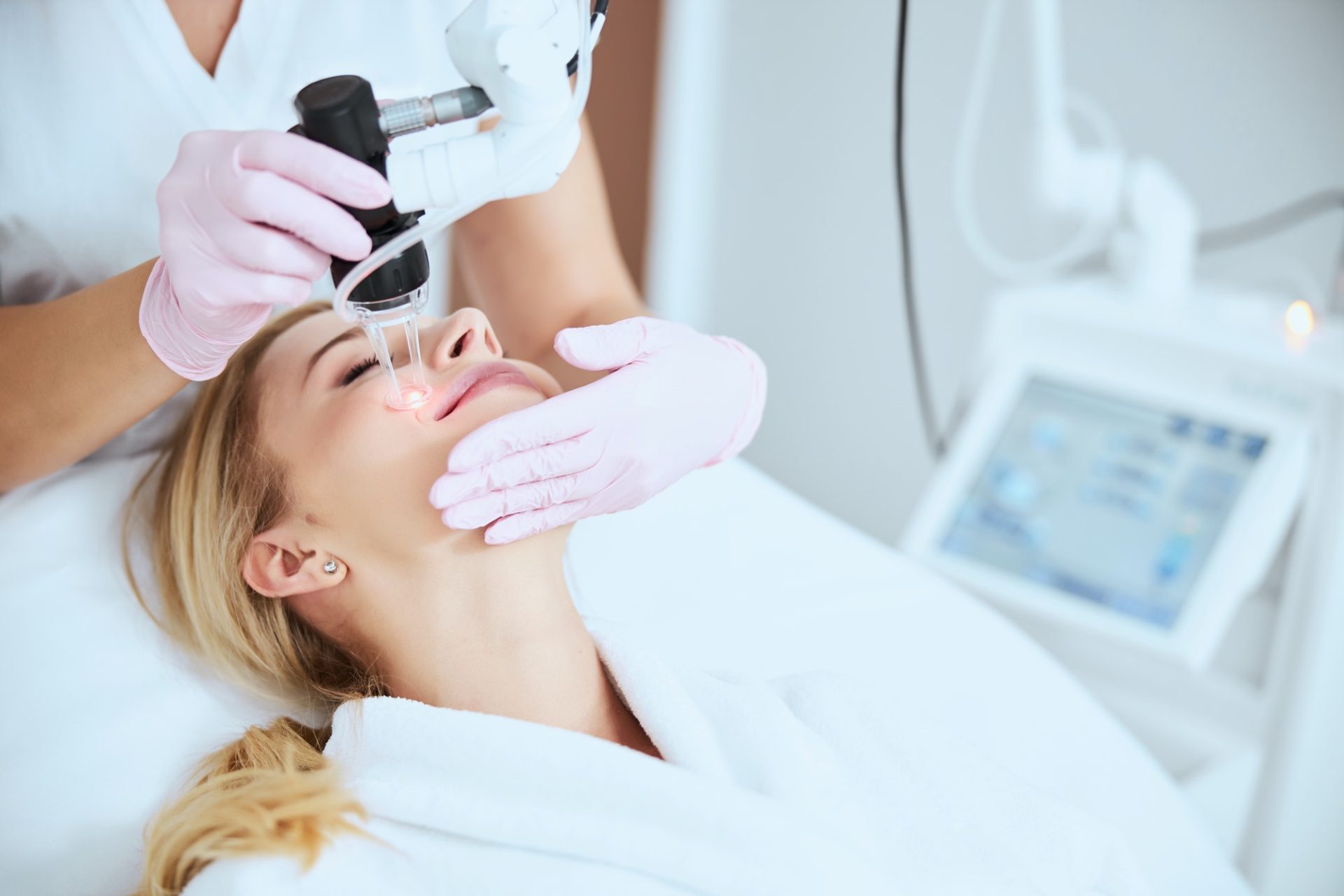 Patient smiling during the skin rejuvenation procedure